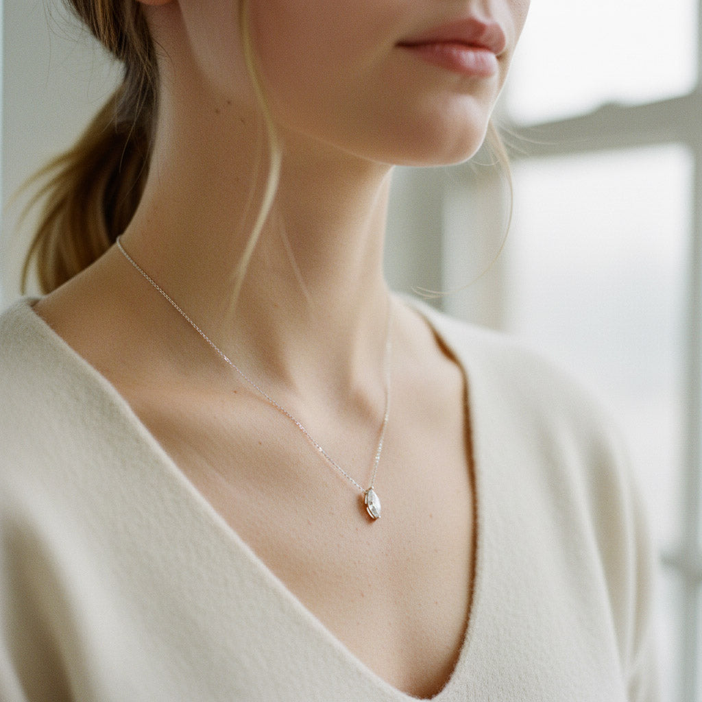 Model wearing 1ct marquise cut moissanite necklace in platinum S925.