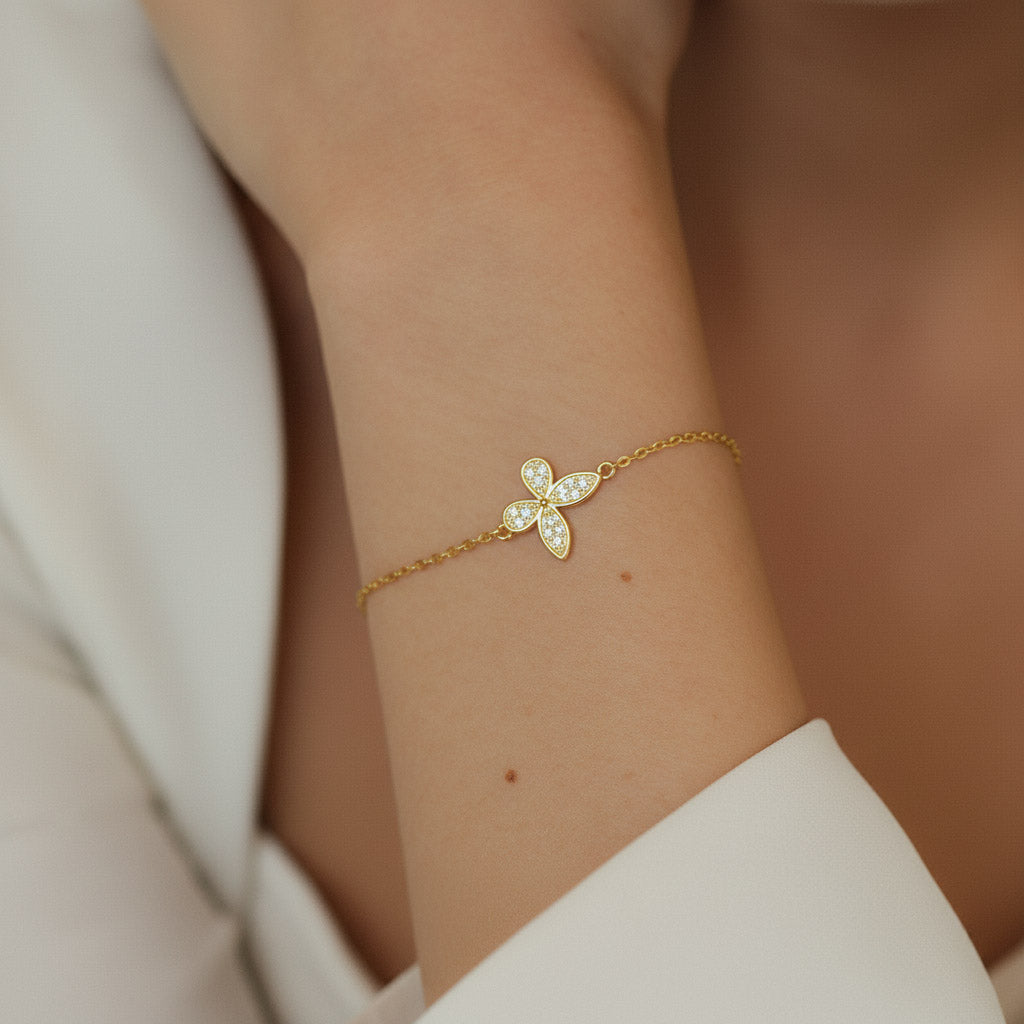 Model wearing gold-plated moissanite butterfly bracelet with 11mm pendant