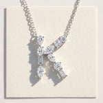 Diamond necklace with a letter K' pendant on a light background