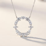 Diamond necklace with a letter 'O' pendant on a light background