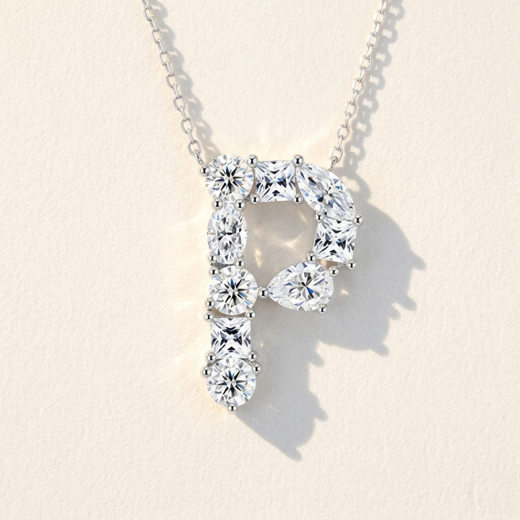 Diamond necklace with a letter 'P' pendant on a light background