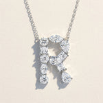 Diamond necklace with a 'R' design on a light background