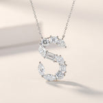 Diamond necklace with a 'S' design on a light background