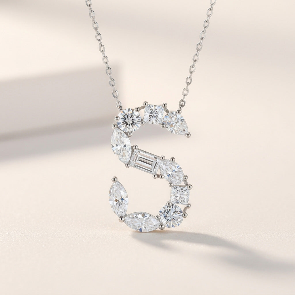 Diamond necklace with a 'S' design on a light background