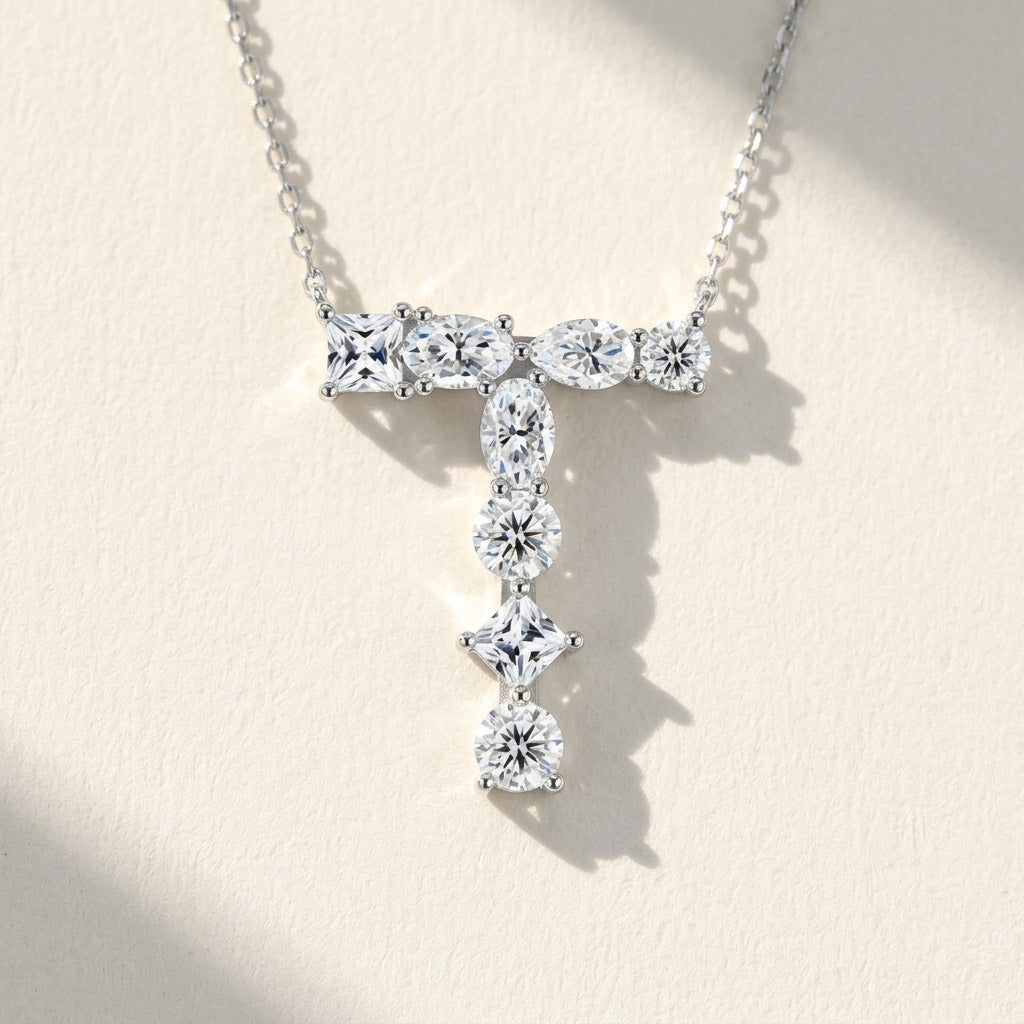 Diamond necklace with a 'T' design on a light background