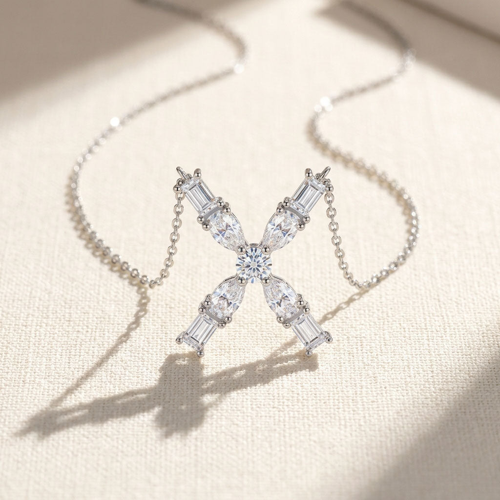 Diamond necklace with a 'X' design on a light background