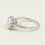 Side profile of oval-cut lab-grown diamond halo ring in platinum-plated sterling silver