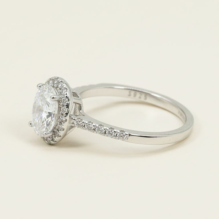 Side profile of oval-cut lab-grown diamond halo ring in platinum-plated sterling silver