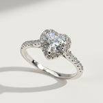 “Heart-shaped lab-grown diamond halo ring in platinum-plated sterling silver with pavé band