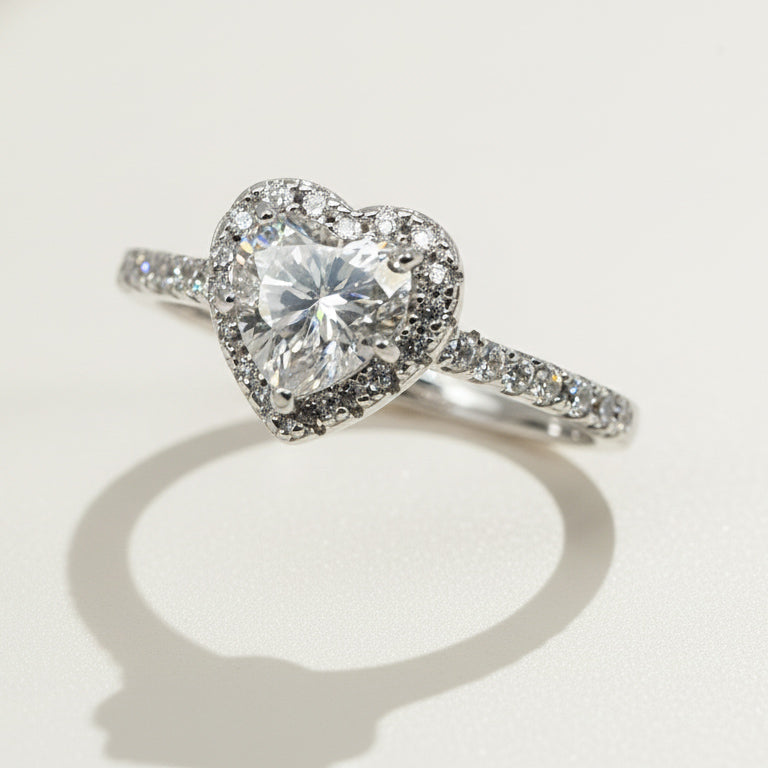 Brilliant heart-cut lab-grown diamond ring surrounded by halo stones on silver band
