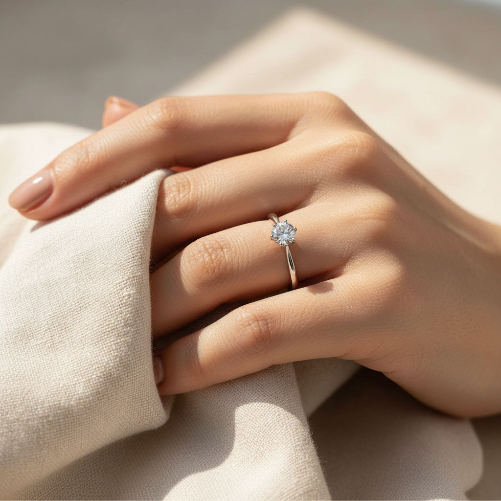 Model wearing sterling silver lab-grown diamond solitaire engagement ring