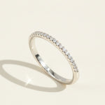 Sterling silver lab-grown diamond eternity band with round brilliant stones in pavé setting