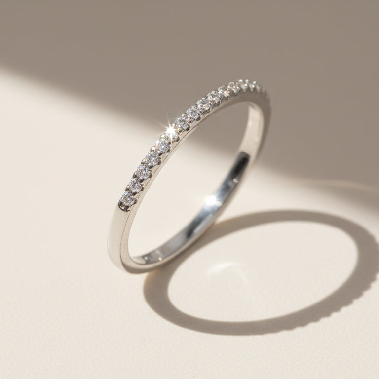 Silver diamond eternity ring with pavé-set round lab-grown diamonds reflecting natural light