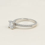 Sterling silver engagement ring with round lab-grown diamond and pavé band details