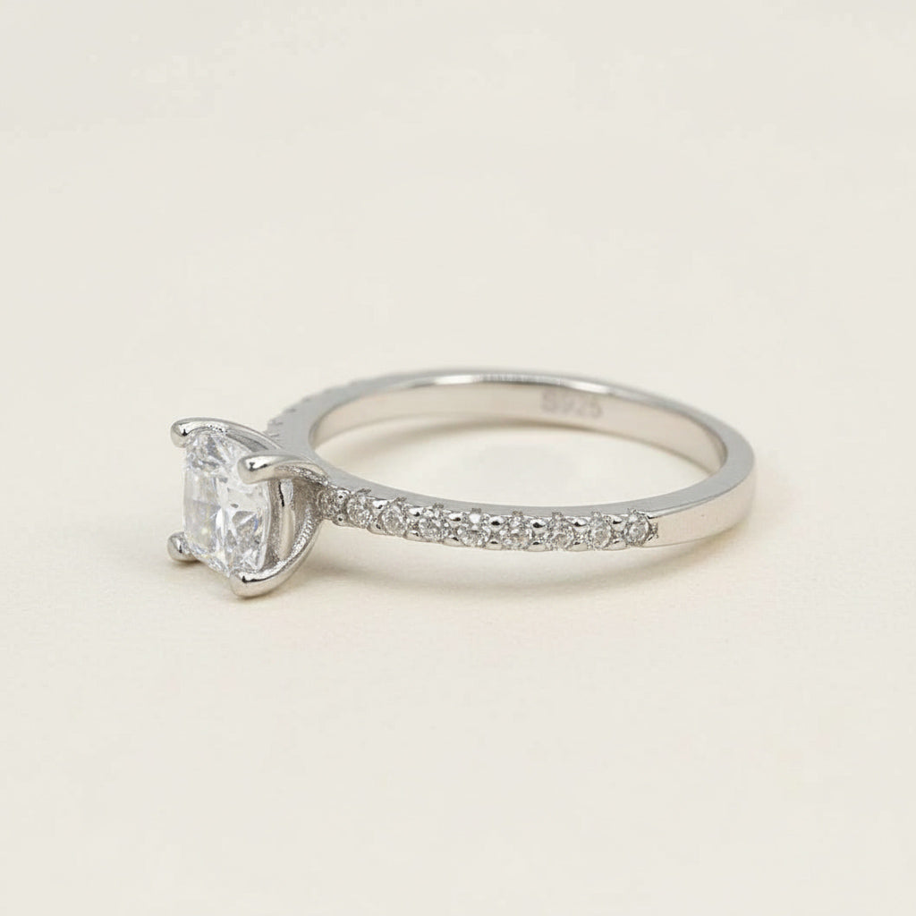 Sterling silver engagement ring with round lab-grown diamond and pavé band details