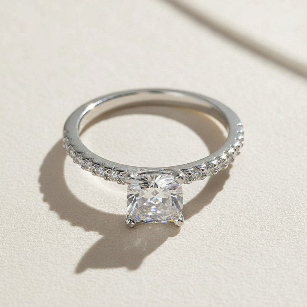 Round-cut lab-grown diamond solitaire engagement ring with pavé band in sterling silver