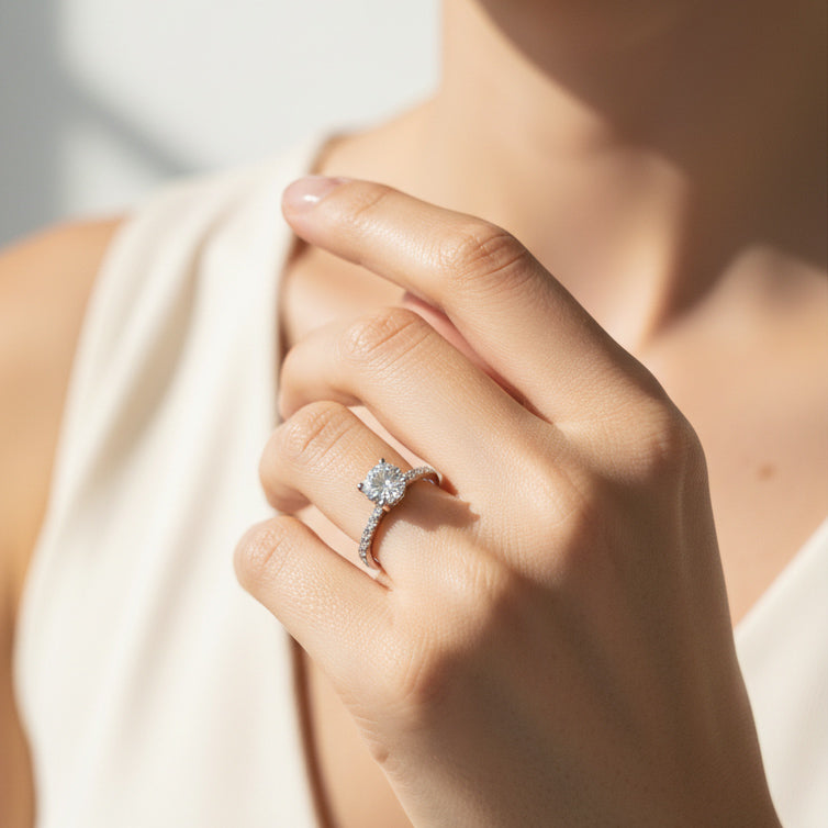 Model wearing round-cut lab-grown diamond solitaire engagement ring in sterling silver
