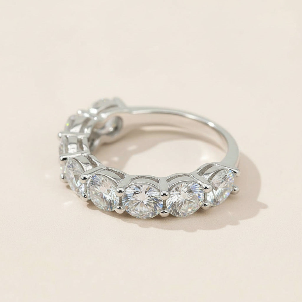 Side view of silver seven-stone diamond band with claw-set round-cut lab-grown diamonds