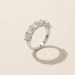 Angled view of sterling silver eternity ring with seven round-cut lab-grown diamonds