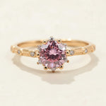 Pink lab-grown diamond ring with 1.0ct round-cut stone and side accents in rose gold-plated silver