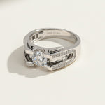 Side view of platinum-plated silver ring with round brilliant moissanite center stone