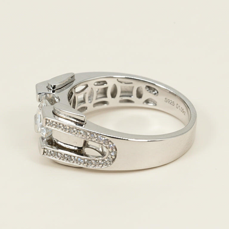 Close-up of silver moissanite ring showing detailed craftsmanship and inner hallmark”