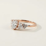 Elegant rose gold marquise-cut diamond ring with tapered cluster setting, lab-grown stones