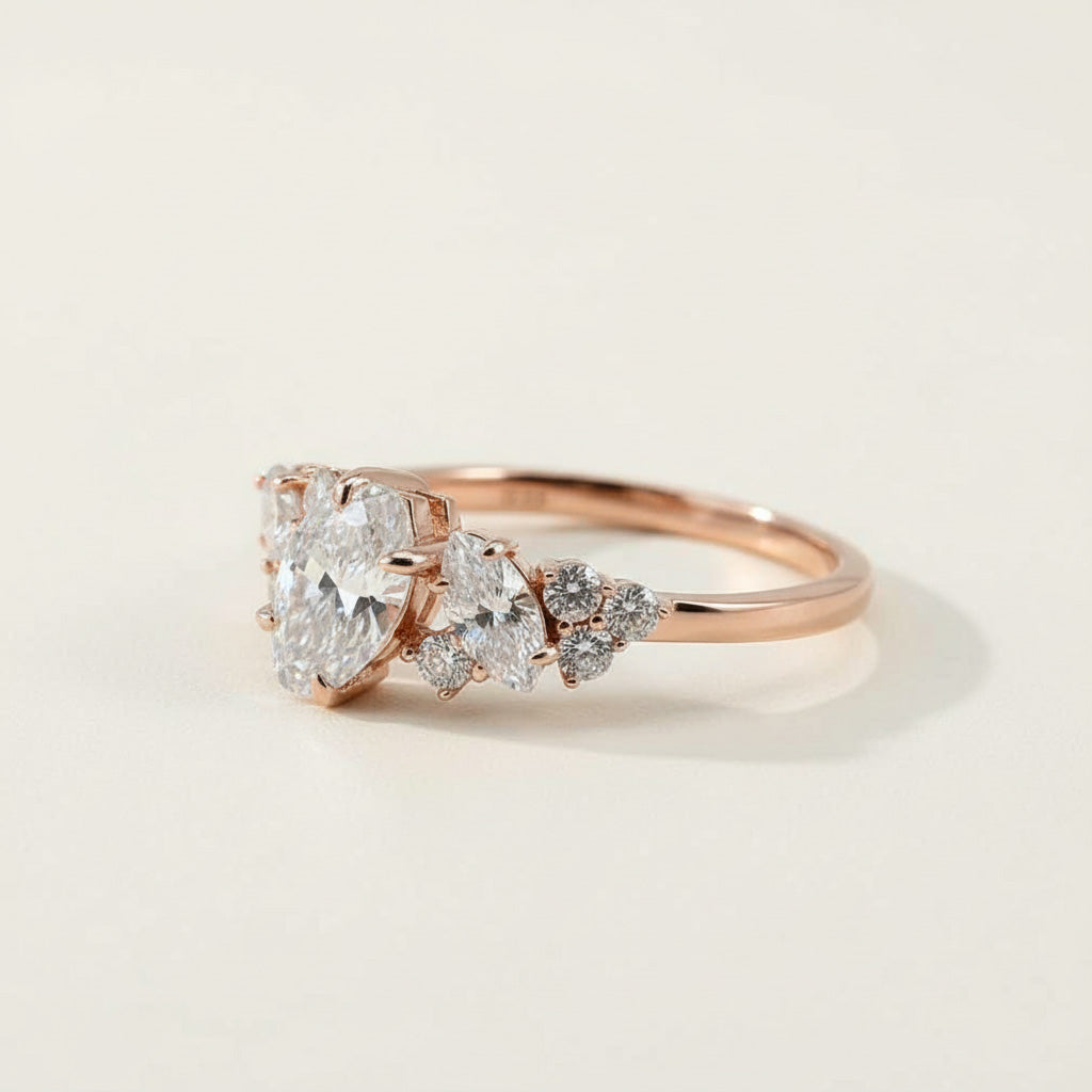 Elegant rose gold marquise-cut diamond ring with tapered cluster setting, lab-grown stones