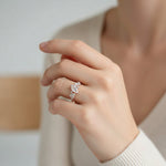 Model wearing rose gold marquise-cut lab-grown diamond ring with cluster side stones