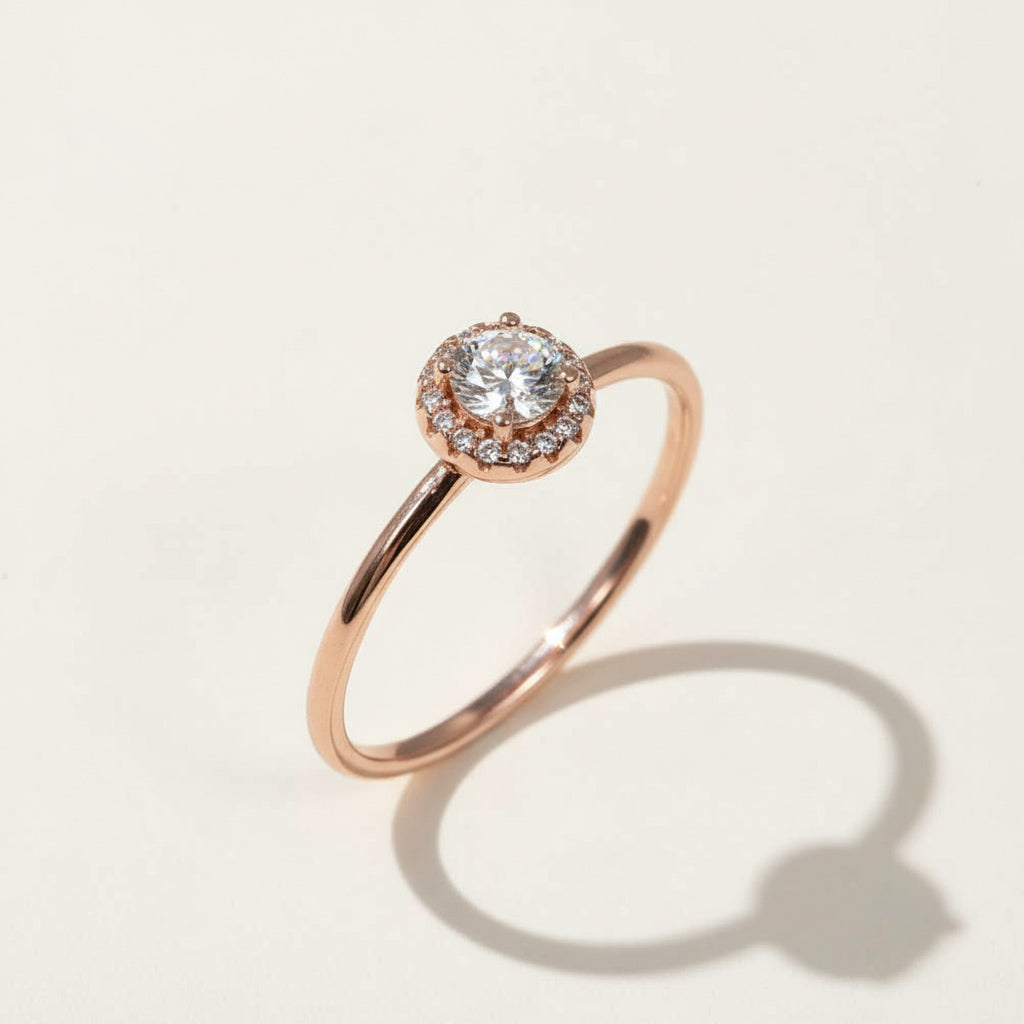 Round halo diamond engagement ring in rose gold, lab-grown center stone with pavé details.