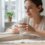 Woman wearing rose gold 2ct moissanite engagement ring indoors