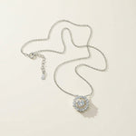 Full necklace with chain and 1ct dancing-stone pendant laid flat
