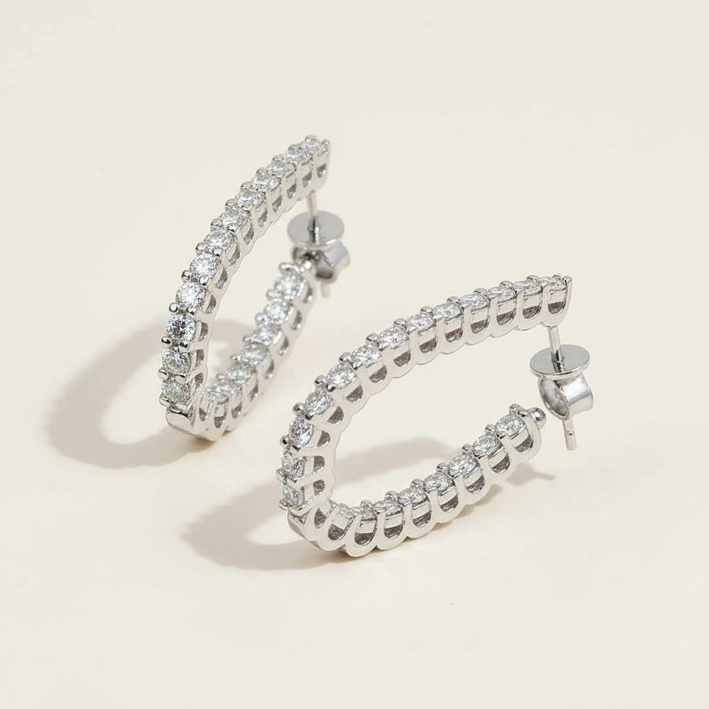Silver diamond hoops with lab-grown stones, claw-set open hoop earrings on neutral background
