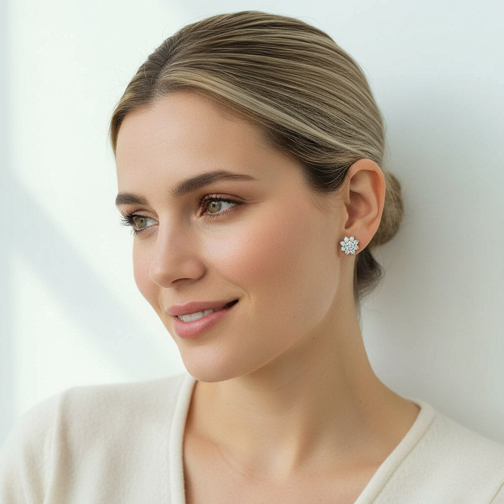 Model close-up wearing floral halo moissanite stud earrings, showing sparkle.
