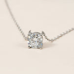 Diamond necklace on a light beige background