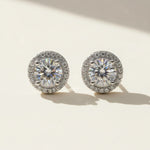 Pair of diamond earrings on a light background
