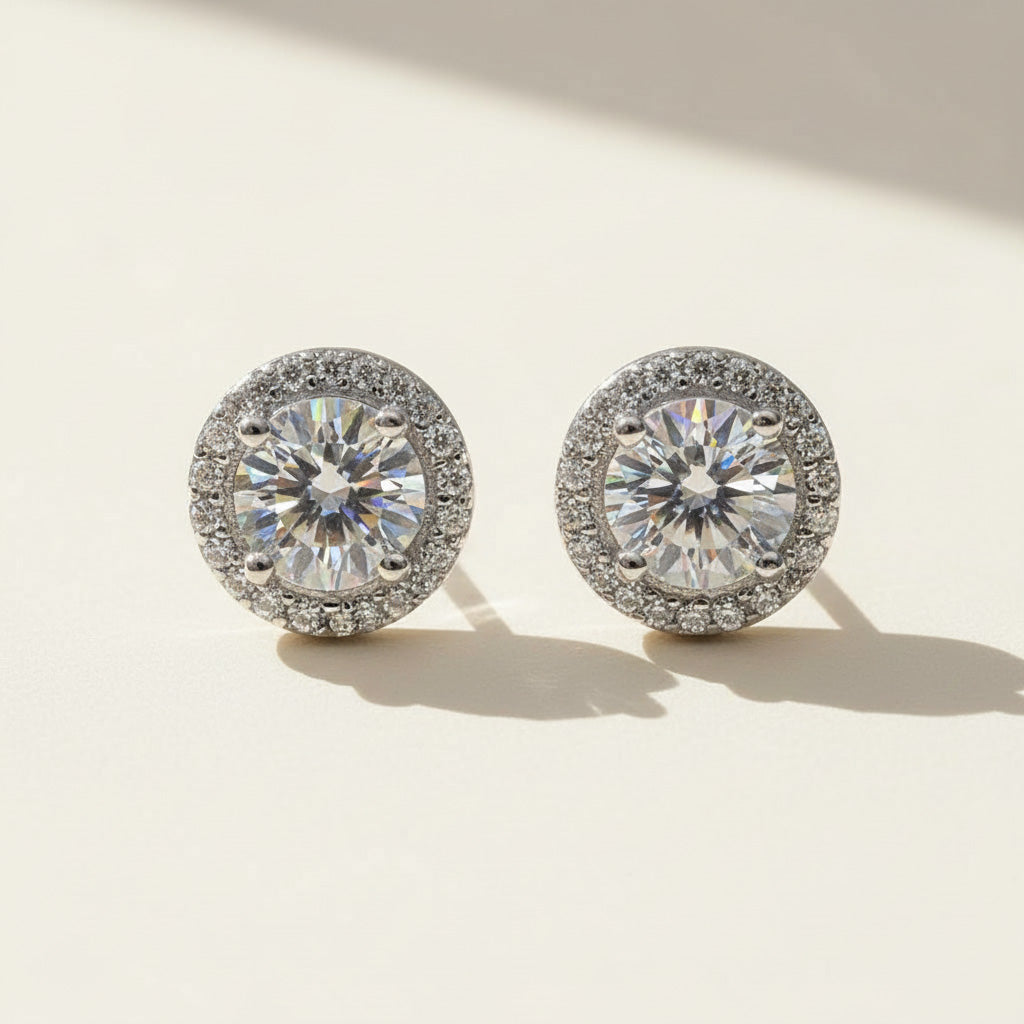 Pair of diamond earrings on a light background