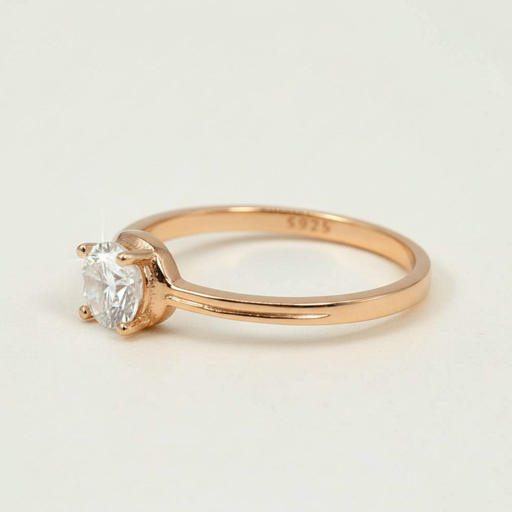 Rose gold-plated sterling silver solitaire engagement ring with round-cut moissanite D/VVS1 1.0ct stone.