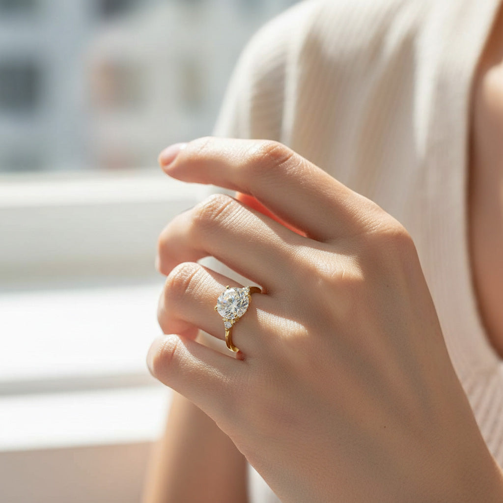 Model hand wearing gold 3ct moissanite ring