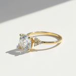 Side angle of gold 3ct moissanite ring with accent stones