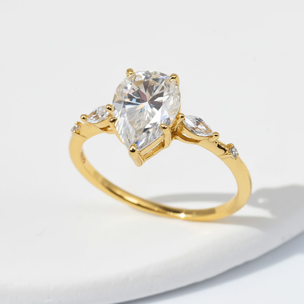 Gold pear cut D/VVS1 moissanite ring on display
