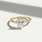 Gold pear cut D/VVS1 2ct moissanite ring close-up