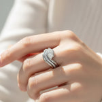 Model wearing sterling silver marquise moissanite bridal ring set