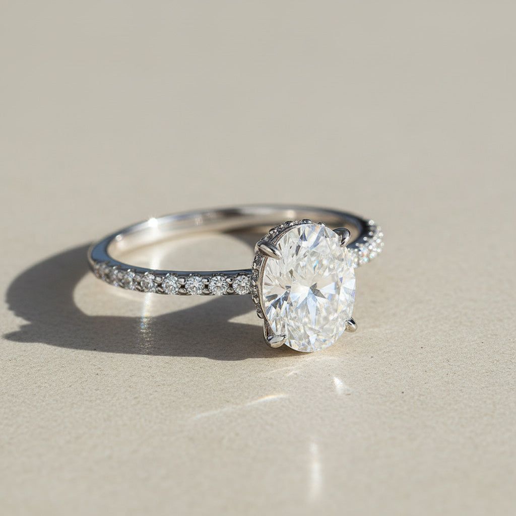 Side view of oval lab grown diamond engagement ring with pavé band