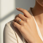 Model wearing 1–2ct lab grown moissanite solitaire ring in gold plated sterling silver