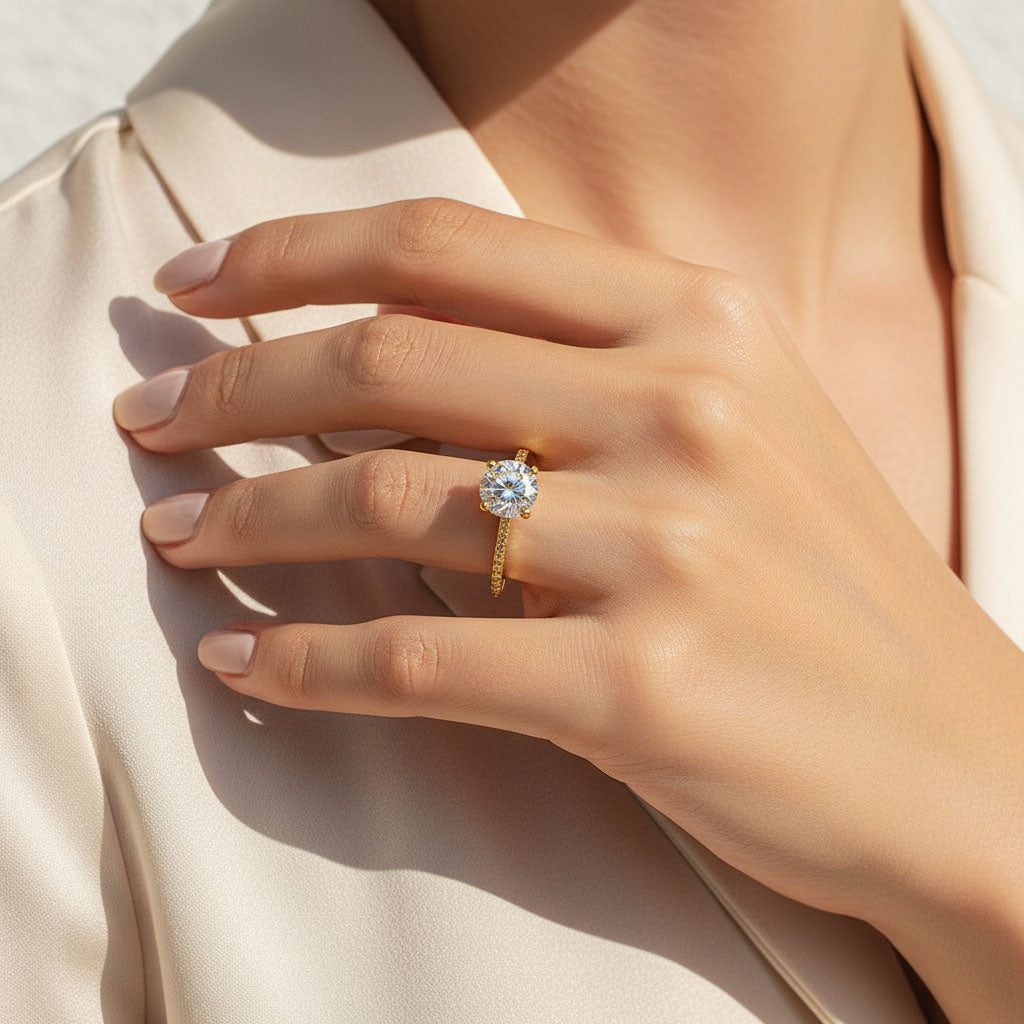 gold plated moissanite solitaire ring with pavé setting on model's hand