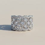 Wide platinum plated silver band ring with lab grown moissanite stones