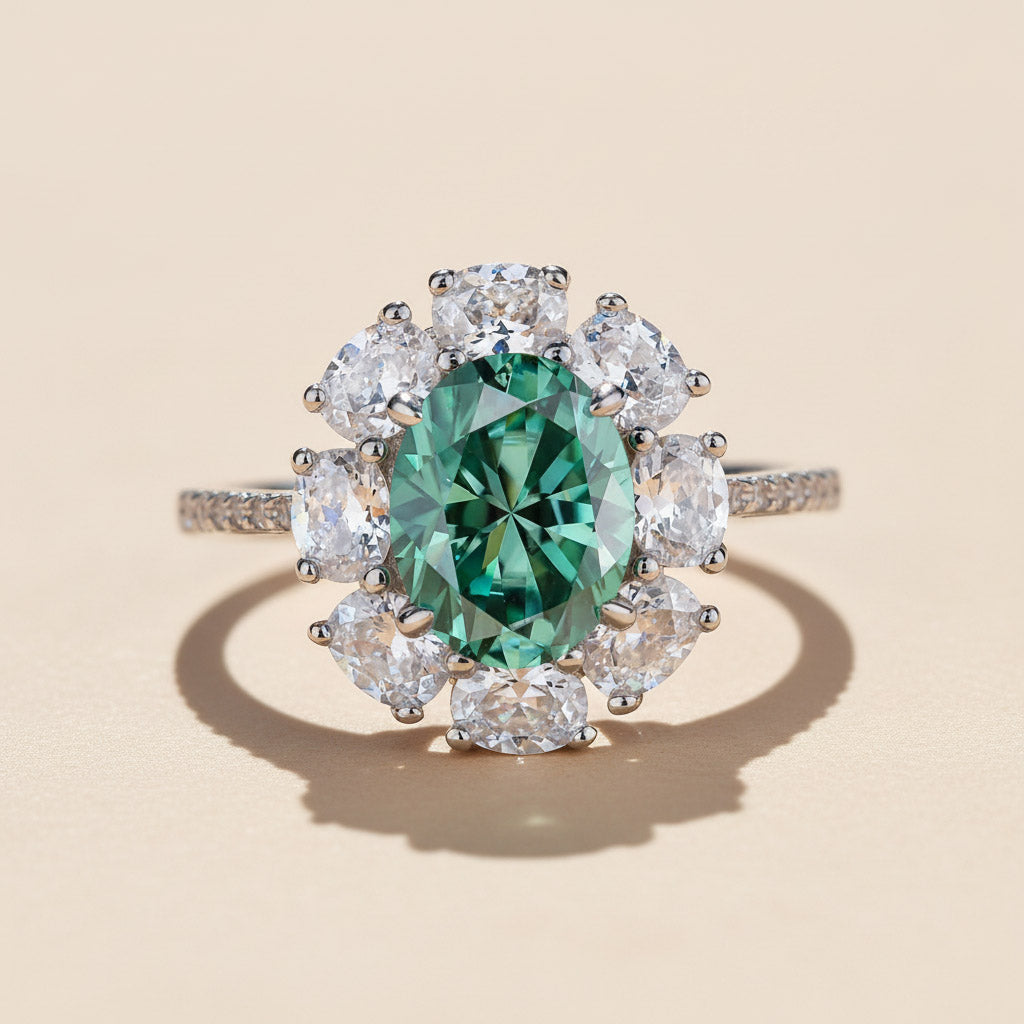 Oval halo ring with topaz blue center stone in platinum plated sterling silver, moissanite accents