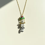 Necklace with a  Monkey-shaped pendant on a light background