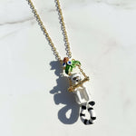 Necklace with a lemur pendant on a light background